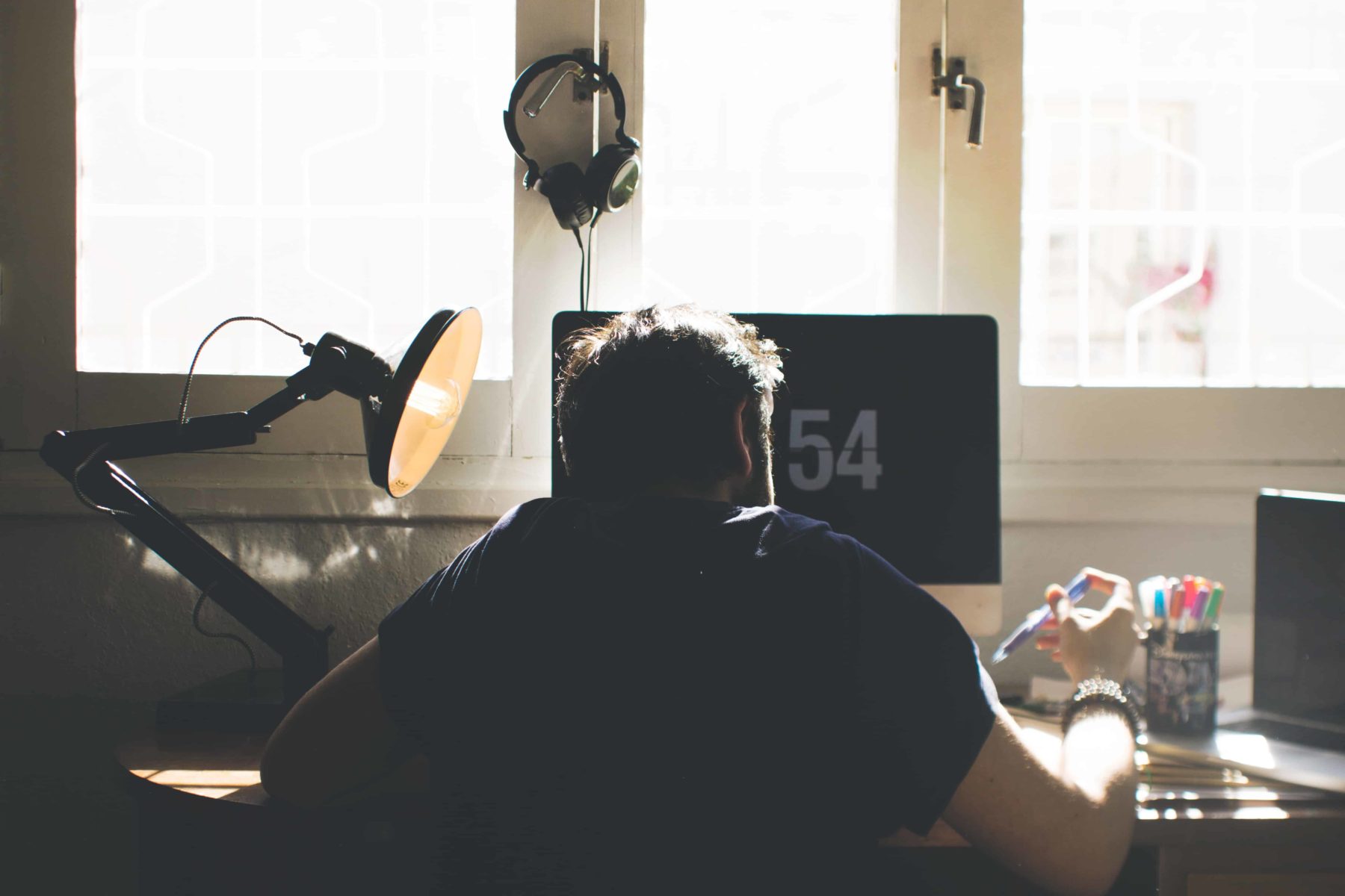 working-fewer-hours-man-working-on-a-desk