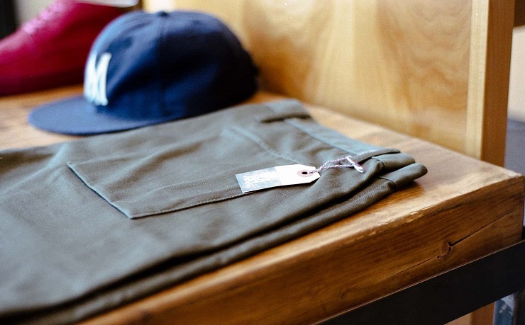 Target audience marketing strategy- Pants and Baseball Cap on desk