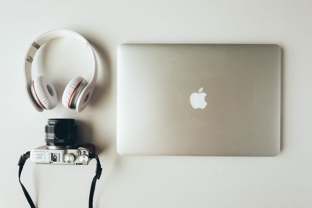 why-we-procrastinate-macbook-with-headset