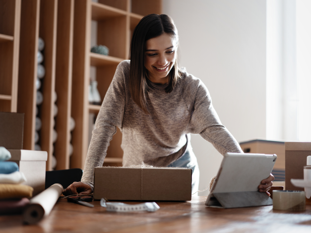 Woman ecommerce business owner smiling photo