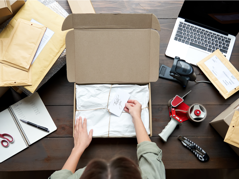 Woman packaging product for business