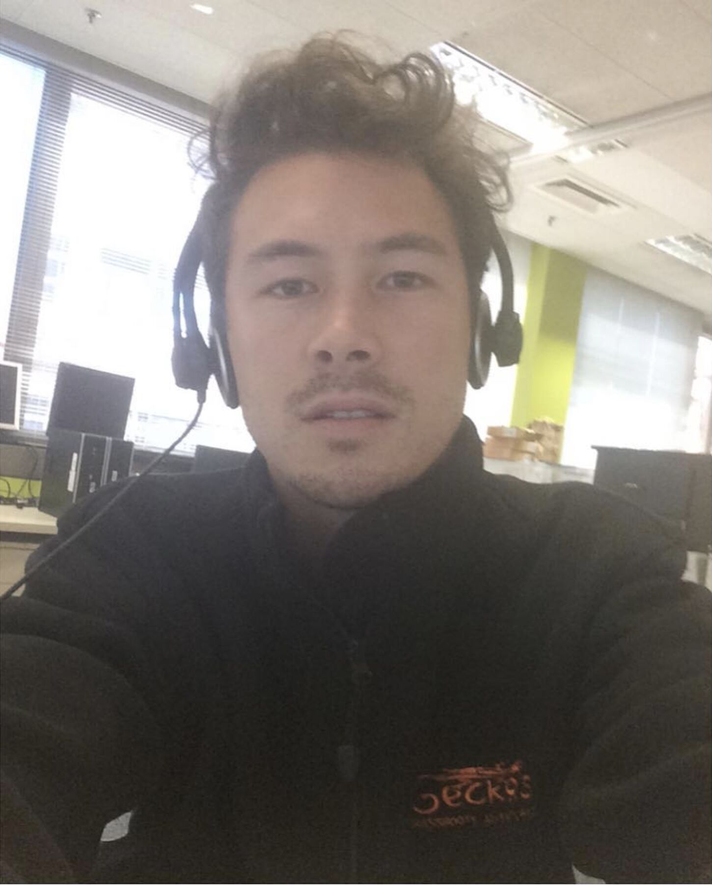Nathan chan working his old it job.